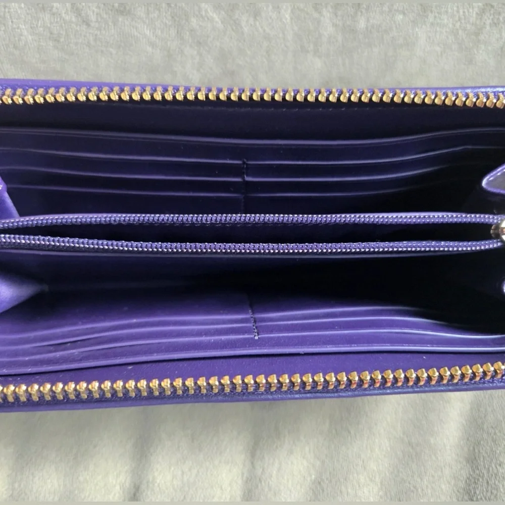 Coach Purple and Dark Brown
Signature PVC Leather Accordian
Zip Wallet - Picture 2 of 5